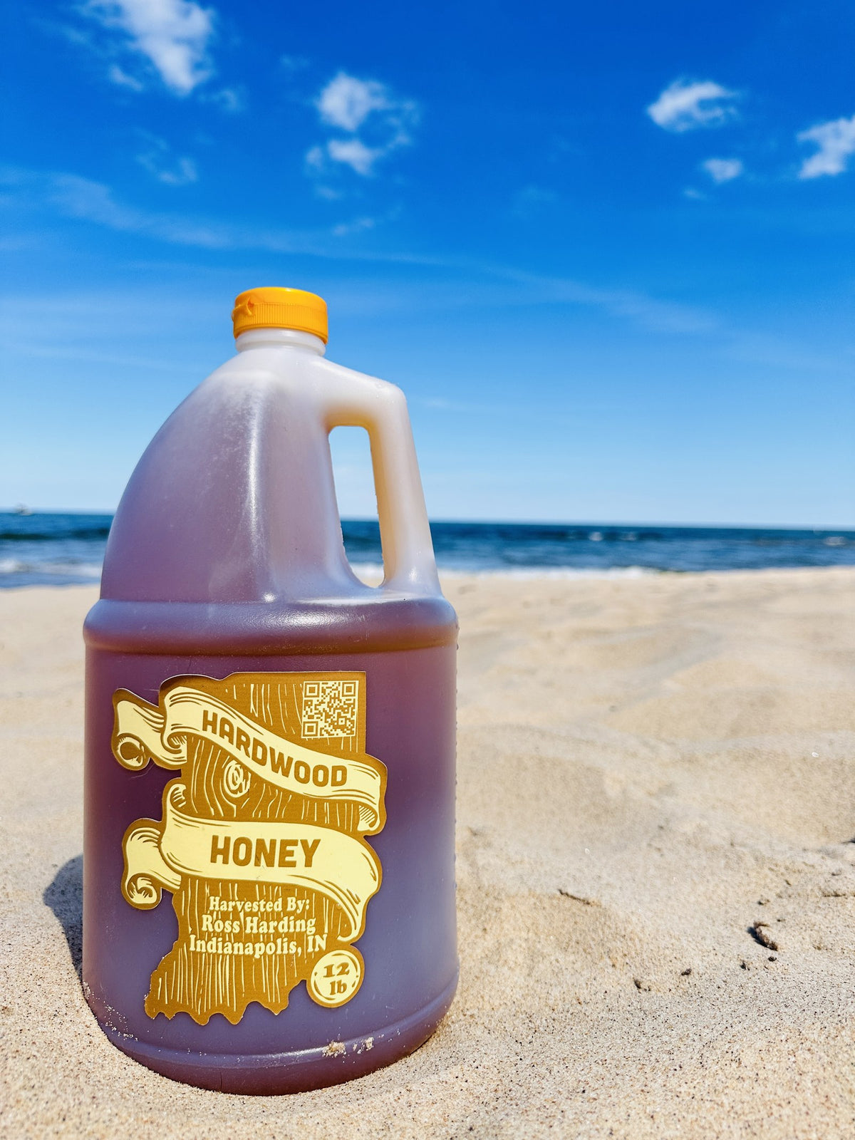 Jug of Hardwood Honey from partner Ross Harding of Indianapolis, IN, on the beach